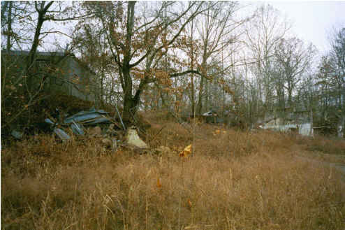 Sixty-one Industrial--building in background; junk debris in foreground