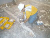 Photo of Emflux sampling over patched concrete floor at Downtown School
