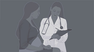 pregnant woman consulting with doctor