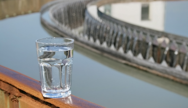 Glass of clear water on a ledge.