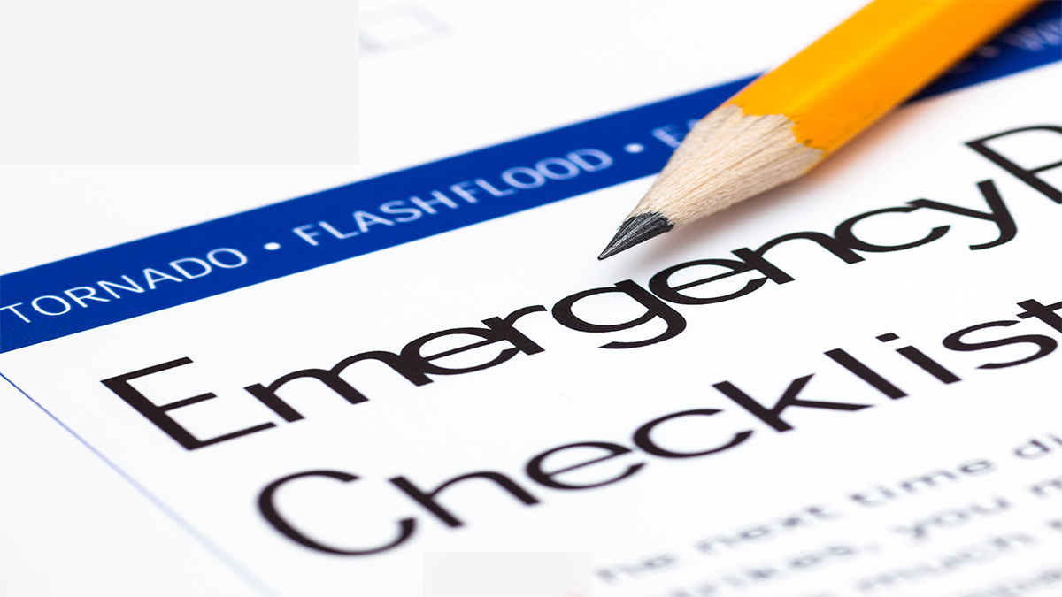 CDART Emergency Checklist Paper form with a pencil on it has a heading of 'Emergency Checklist'. The words 'tornado' and 'flashflood' also appear.