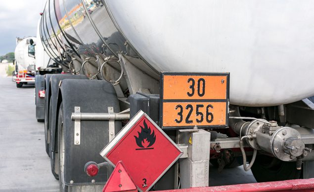 Tanker truck with emergency hazard sign Tanker truck with emergency hazard sign