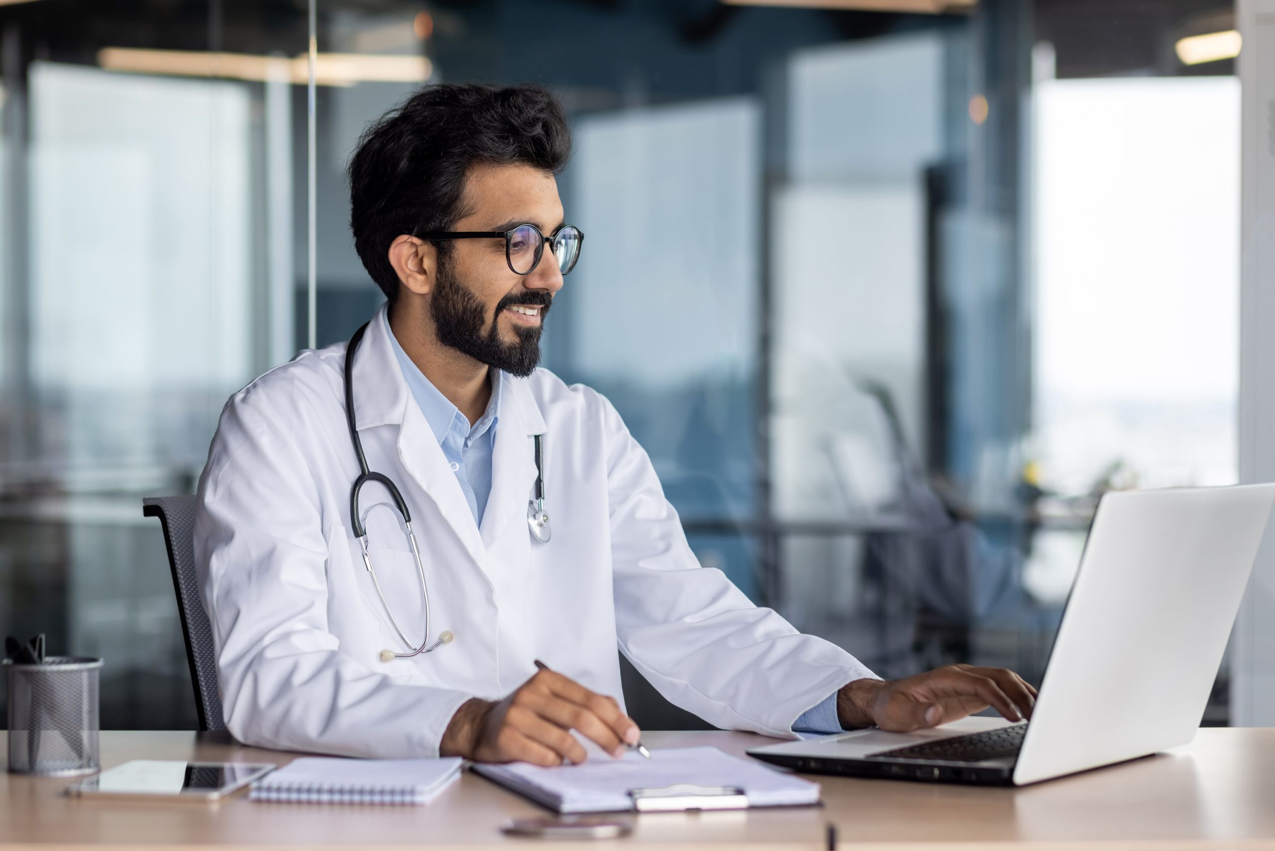 Doctor working on laptop