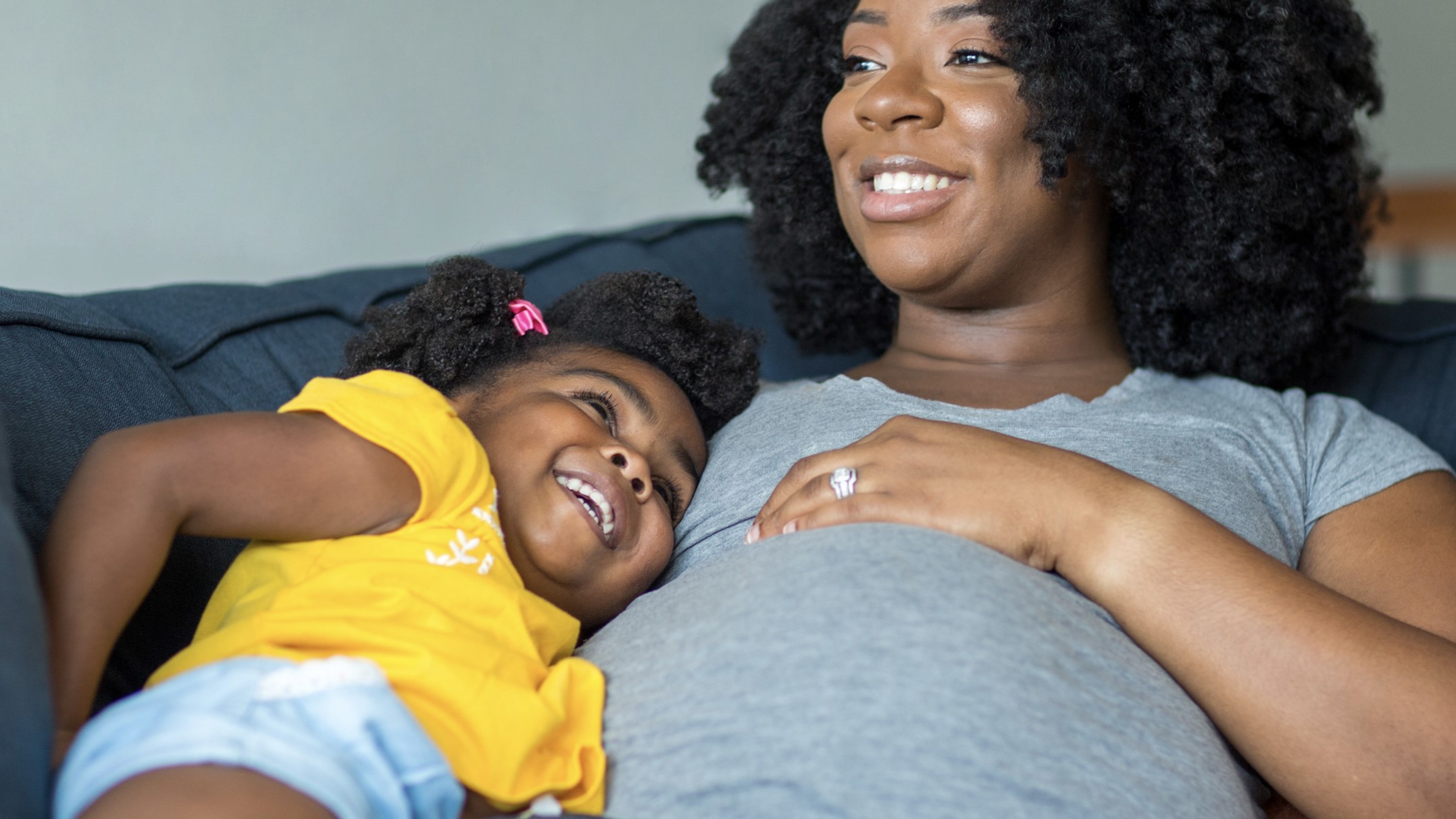 pregnant mother African American pregnant mother and daughter