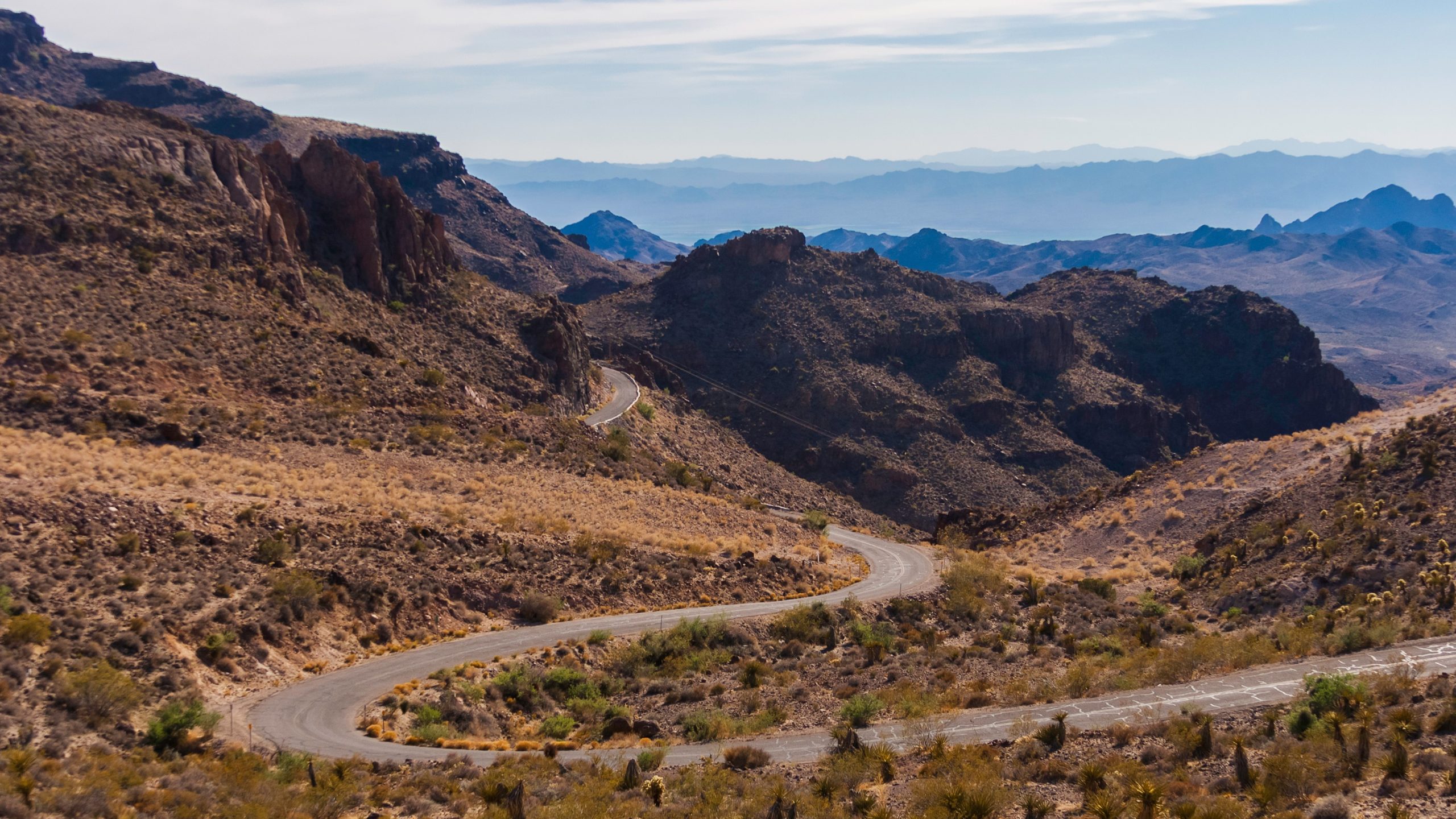 Region 9 Winding mountain road in rugged, treeless setting.