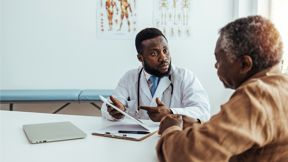 Clinician with patient during consultation