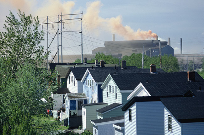 Row of houses near a factory building