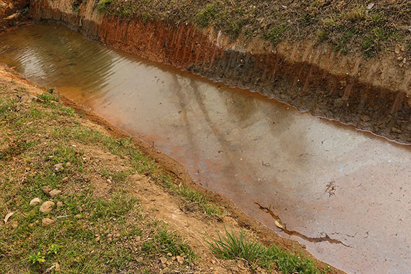 Contaminated river with brown water