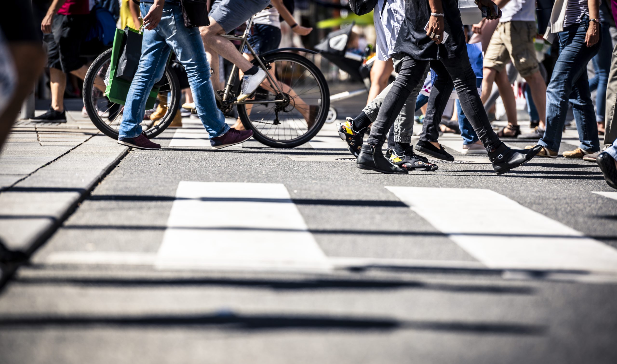 Pedestrians walking and biking at a crosswalk