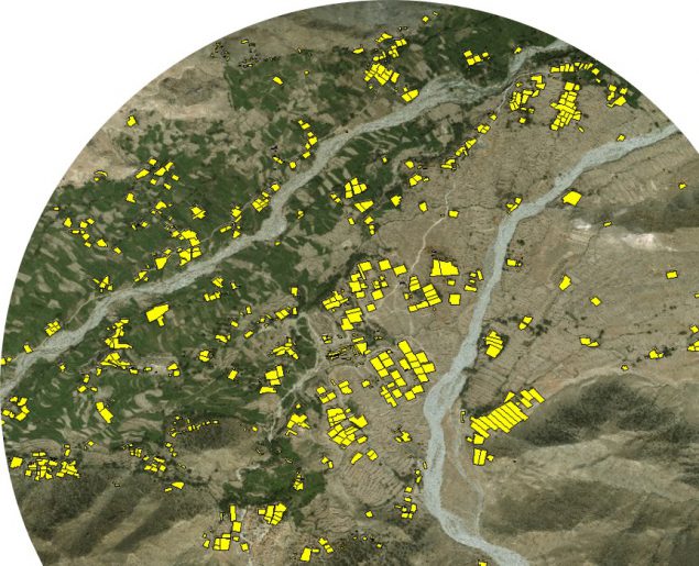 Satellite image with building structures highlighted in yellow.