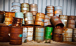 improperly stored 55-gallon drums that are in poor condition 