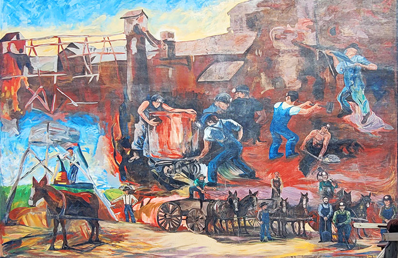 Photo of a painted mural in Granby that depicts various historic mining imagery.